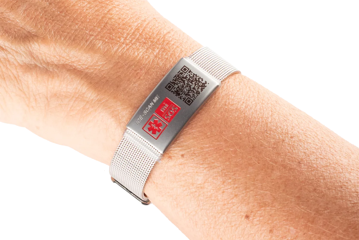 Stainless steel mesh mi-SOS band worn on a wrist
