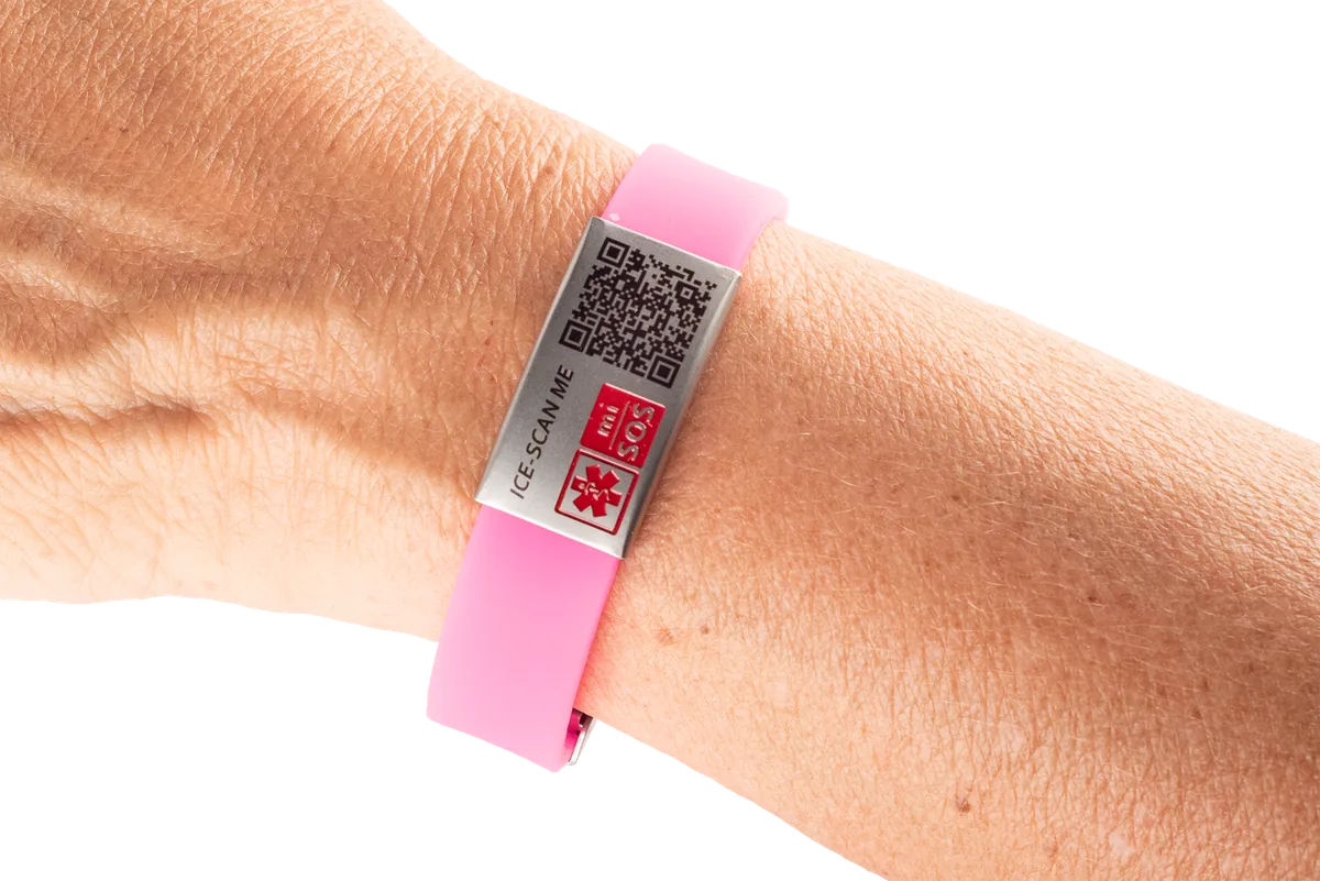 Pink silicone mi-SOS band worn on a wrist
